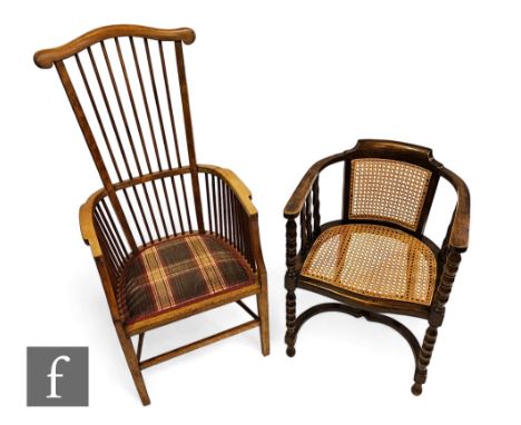 A 20th Century high comb back beech elbow chair, the shaped back rail over a tartan covered seat on square legs united by rai