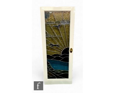 A 1930s Art Deco leaded light and coloured stained glass internal door and frame, sunburst design with birds in flight over a