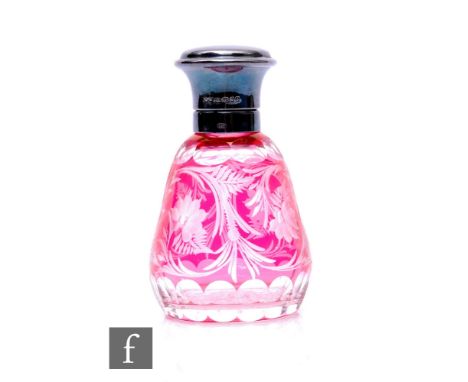 An Edwardian silver topped glass scent bottle with stopper, engraved ruby flashed conical base, height 12cm.  PLEASE VIEW CON