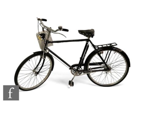 A 1960s Dunelt bicycle, 24 inch spoked wheels, painted black, with Sturmey Archer three speed control, black mud guards, with