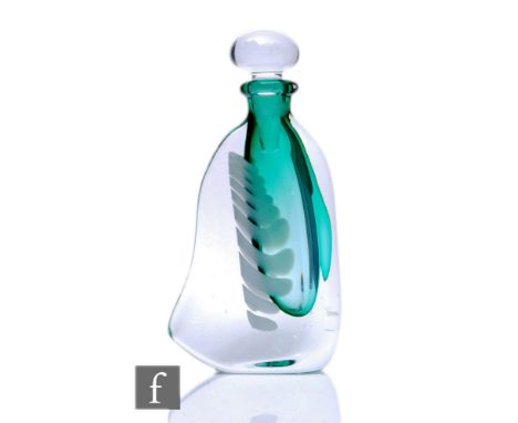 A Karlin Rushbrook studio glass scent bottle of compressed form, clear glass over ribbed opal and green glass, engraved signa