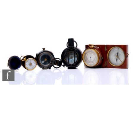 A 19th Century leather cased pocket barometer by J Hicks London, a similar small brass compass another in mahogany case and t