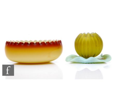 A Stourbridge satin glass sherbert dish, in the form of a waterlily bud on folded lily pad base, striated air trap decoration