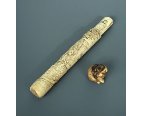 A 19th century bone pipe case together with a puppy netsuke, the first carved in low relief with a lady accompanied by two ch