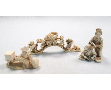 Three late 19th/early 20th century ivory okimonos, one carved as two oni pushing a conch shell on a cart over a bridge, signe