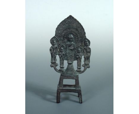 A Wei dynasty bronze Buddhist votive group, the five incarnations of the Buddha with leaf shaped mandalas as they stand on lo