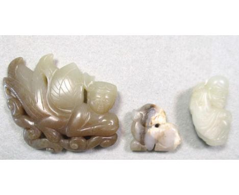 A jade winged human, Shoulao and a goat pendants, the pale green half human flying on toffee coloured clouds, 7cm (2.75 in) w