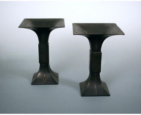A pair of early 20th century bronze 'Gu' shaped vases, the square rims flaring above a rib central to each side, the central 