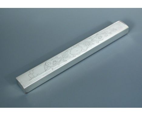 An unmarked silver incense stick box, hinged lids at either end of the rectangular shape engraved on one side with lotus scro