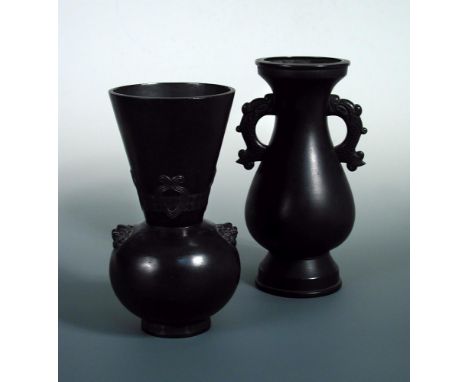Two late 19th/early 20th century bronze vases, one of baluster shape with two stylised dragon handles. 27cm (10.75 in) high a