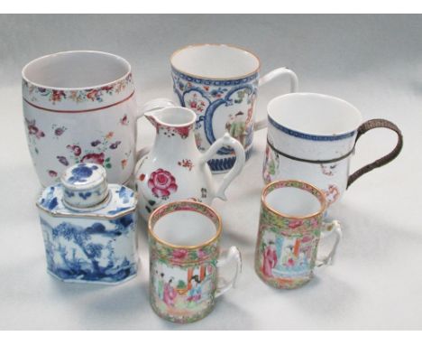 Five 18th and 19th century mugs, a jug, a blue and white tea caddy and cover, the three famille rose pint mugs and jug, circa