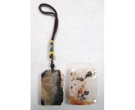 A rectangular shadow agate pendant together with a jade pendant, the first carved in relief on one side with a figure seated 