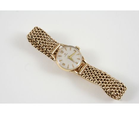 A LADY'S 9CT. GOLD WRISTWATCH BY OMEGA the signed circular dial with Arabic quarters and dagger numerals, on a 9ct. gold brac