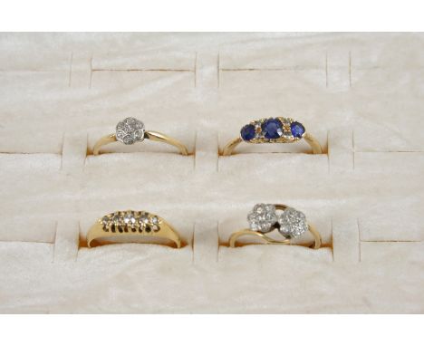 A SAPPHIRE AND DIAMOND RING the three graduated circular-cut sapphires are set with four small diamonds, in gold, size O, a d