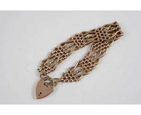 A 9CT. GOLD FANCY GATE LINK BRACELET with padlock clasp, 19cm. long, 19.6 grams. 