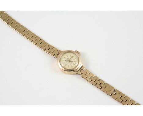 A LADY'S 9CT. GOLD WRISTWATCH the circular dial with baton numerals, on an integrated gold bracelet with ladder clasp, 14.7 g