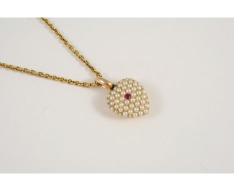 A VICTORIAN RUBY AND PEARL PENDANT the heart-shaped pendant is centred with a circular-cut ruby within a surround of small pe