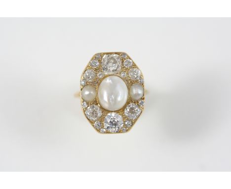 A DIAMOND AND PEARL CLUSTER RING centred with a blister pearl within a surround of graduated old brilliant-cut diamonds and t