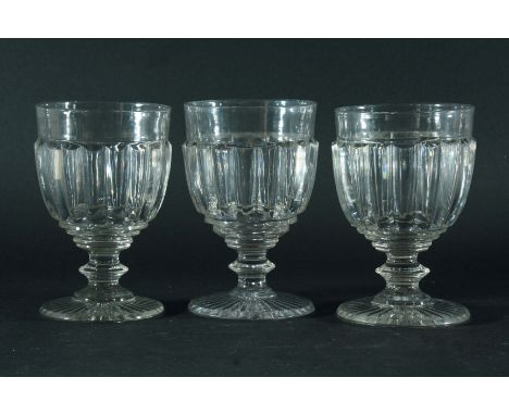 SET OF EIGHT WILLIAM IV GLASS RUMMERS, with reeded or cut pillar decoration, knopped stem and sunburst cut circular base, 15c