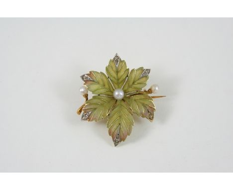 AN ENAMEL, DIAMOND AND PEARL BROOCH the plique-a-jour enamel flowerhead is centred with a pearl, and is set with two further 