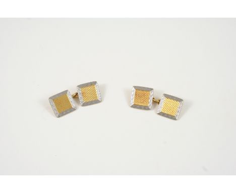 A PAIR OF 18CT. GOLD AND PLATINUM CUFFLINKS of square form, with engine turned decoration, 8.1 grams. 