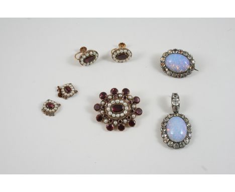 A QUANTITY OF JEWELLERY including a Georgian garnet and half pearl mourning brooch, 4cm. wide, a Georgian gold mourning brooc