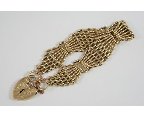 A 9CT. GOLD FANCY GATE LINK BRACELET with padlock clasp, 29 grams. 