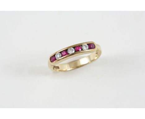 A RUBY AND DIAMOND HALF HOOP RING alternately set with circular-cut diamonds and rubies in 9ct. gold. Size J 1/2. 