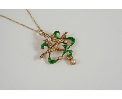 AN EARLY 20TH CENTURY ENAMEL AND PEARL BROOCH PENDANT of foliate openwork form, set with green quilloche enamel and half pear