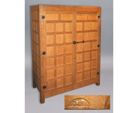 ROBERT THOMPSON OF KILBURN - 'MOUSEMAN' WARDROBE the oak wardrobe with a panelled front and sides, with circular metal hinges