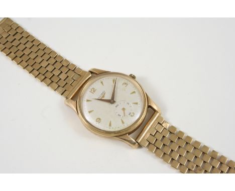 A GENTLEMAN'S 9CT. GOLD WRISTWATCH BY LONGINES the signed white enamel dial with Arabic quarters and dagger numerals, subsidi
