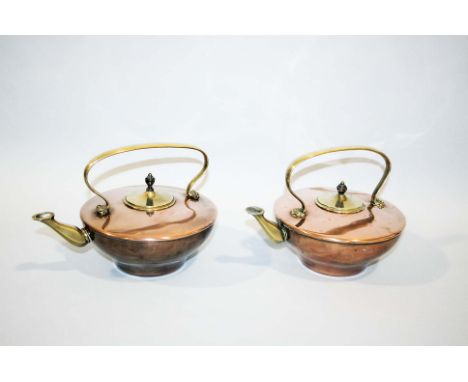 W.A.S BENSON - PAIR OF ARTS & CRAFTS KETTLES a pair of Arts and Crafts kettles with a copper body and brass handle, spout and