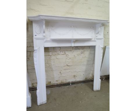 A white painted pine Adams style fire surround - Height 141cm x Width 138cm - internal 95cm x 95cm 