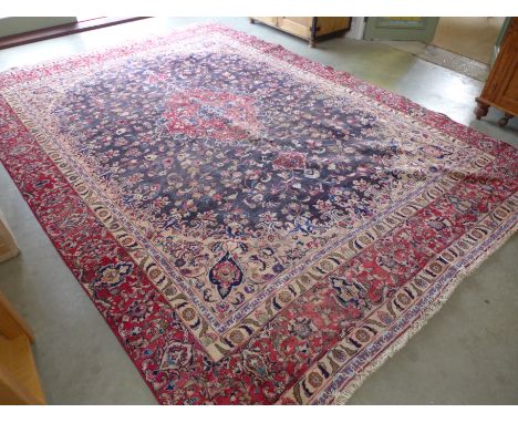 A fine hand woven Tabriz carpet with central medallion on floral design field - 368cm x 266cm 