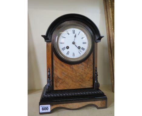 A walnut and ebony 8 day mantle clock - strikes hours and halfs