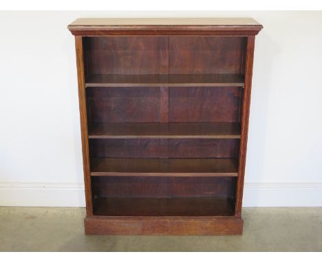 An oak three shelf adjustable bookcase - Height 107cm x 84cm x 24cm