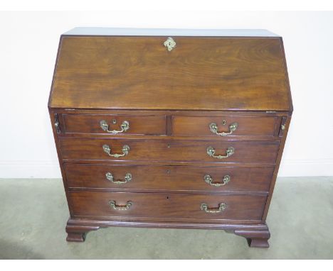 A good quality Georgian mahogany bureau with a fall front and fitted interior of drawers and pigeon holes, over two short and