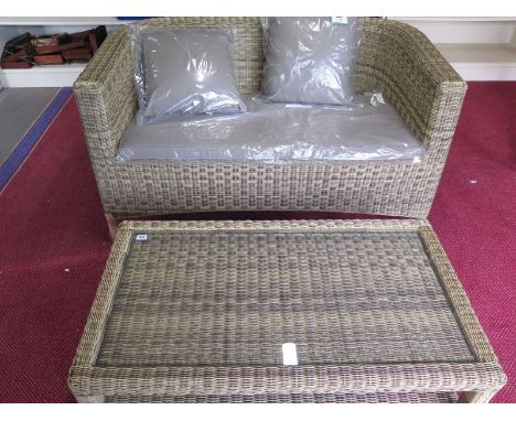 A Bramblecrest Sahara Classic two seater sofa with cushion and a coffee table - slight damage to one arm