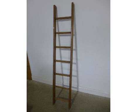 A vintage seven rung ladder, polished for decorative use - Height 187cm 