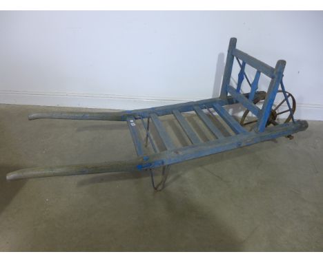 A vintage single wheel barrow with original blue paint, waxed for decorative purposes - Length 180cm 