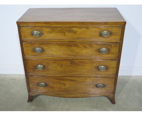 A Regency mahogany chest with four long graduating drawers on splayed bracket feet - Height 91cm x 93cm x 46cm
