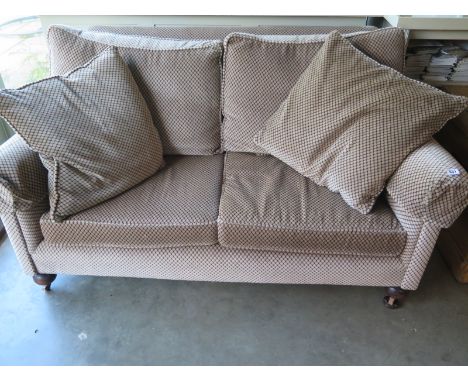 A late Victorian two seater sofa recently upholstered with loose cushions