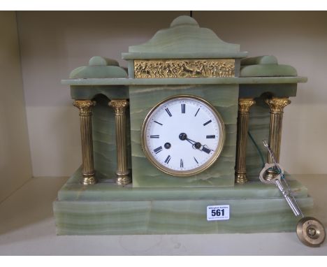 A 19th century green onyx mantle clock strikes on a bell