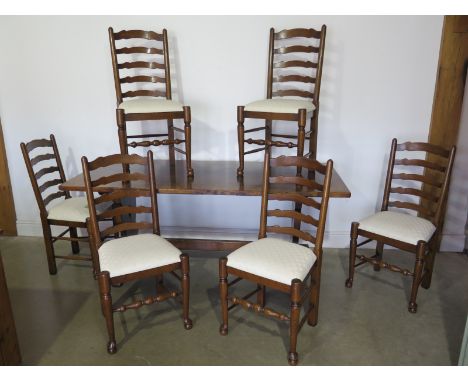 An oak refectory table from Titchmarsh and Goodwin  - Height 76cm x 183cm x 80cm with six oak ladder back chairs 