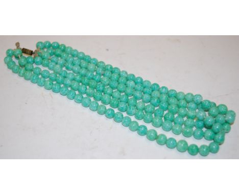 A beaded jade triple string choker