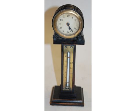 A late Victorian ebonised and brass mounted combination clock thermometer 