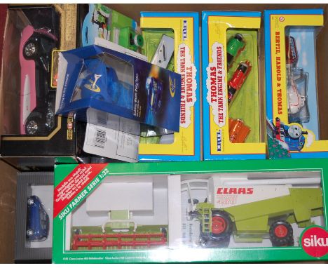 Three various Ertl Thomas the Tank Engine boxed vehicles, to include Bertie, Harold and Thomas, Terence, James and Percy, Tob