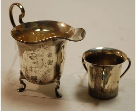 An Edwardian silver miniature tyg, by William Aitken; together with a silver helmet form cream jug (2) 