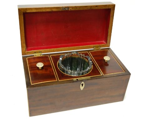 A George III mahogany and boxwood strung tea caddy, of plain rectangular form, having a fitted two compartment interior with 