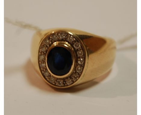 A gents 18ct gold, sapphire and diamond set dress ring, the blue sapphire weighing 1.57ct, size R Condition Report / Extra In